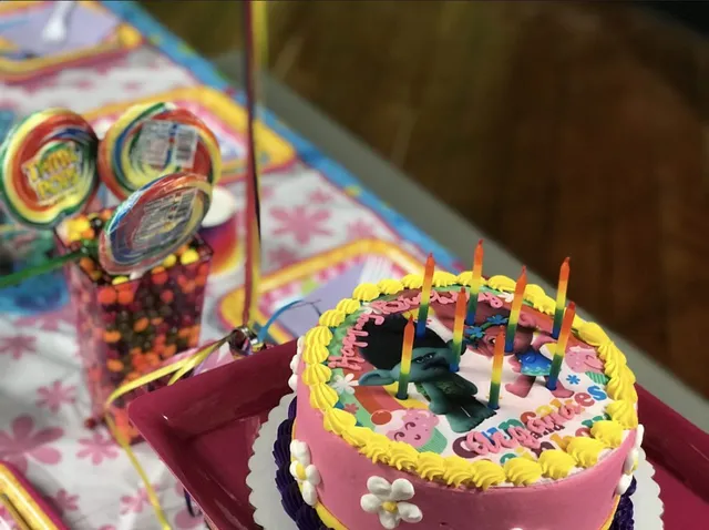 Birthday party setup with cake and decorations at a Fly High park